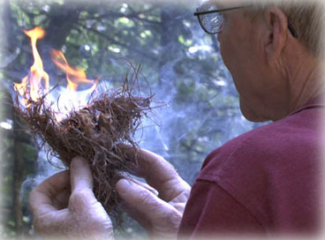 Jim with flaming tinder bundle